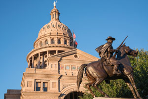 Texas Capitol with Texas Rangers Monument Statue