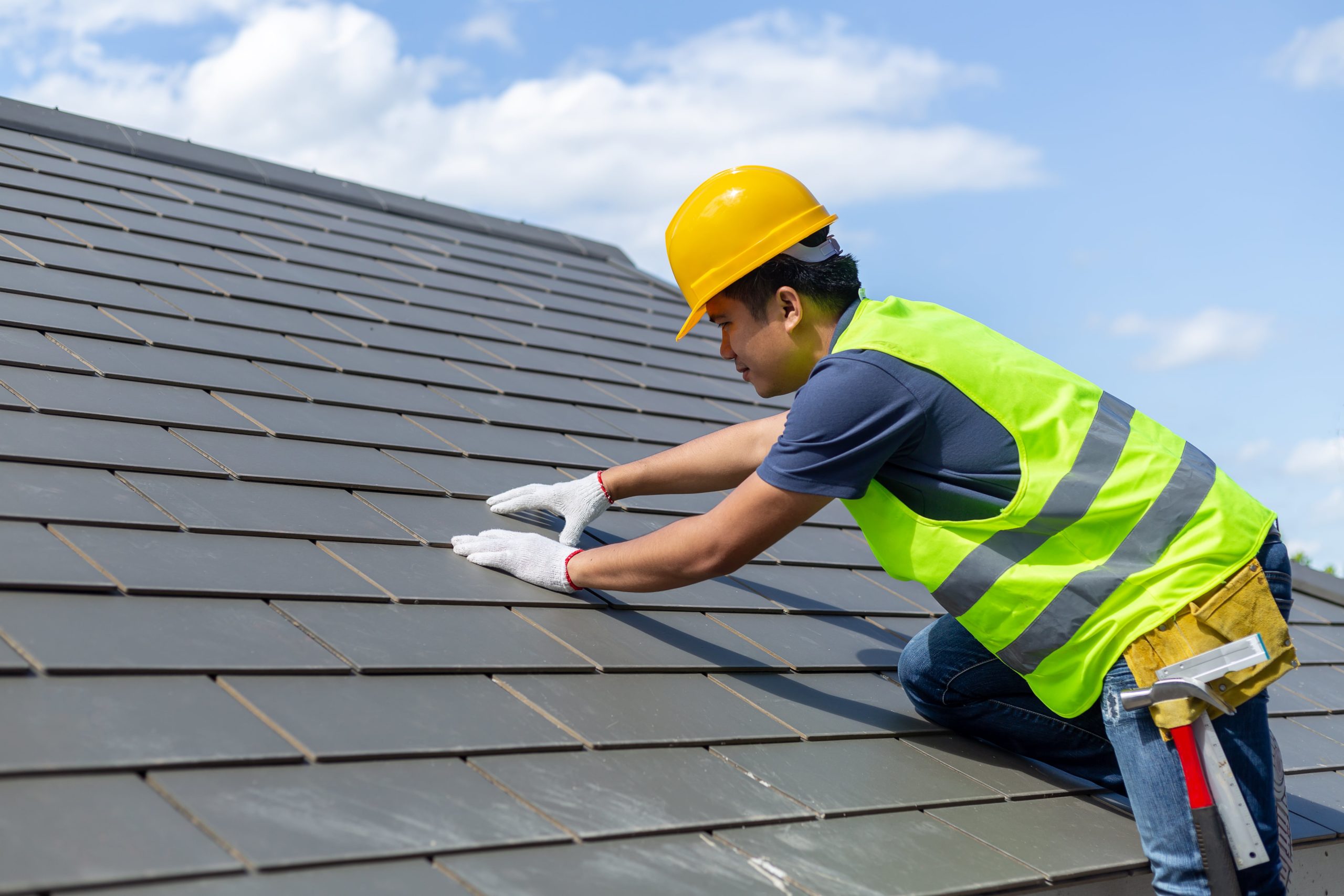 Roofer Working on a Roof - Roofing Companies - Get Your Quote