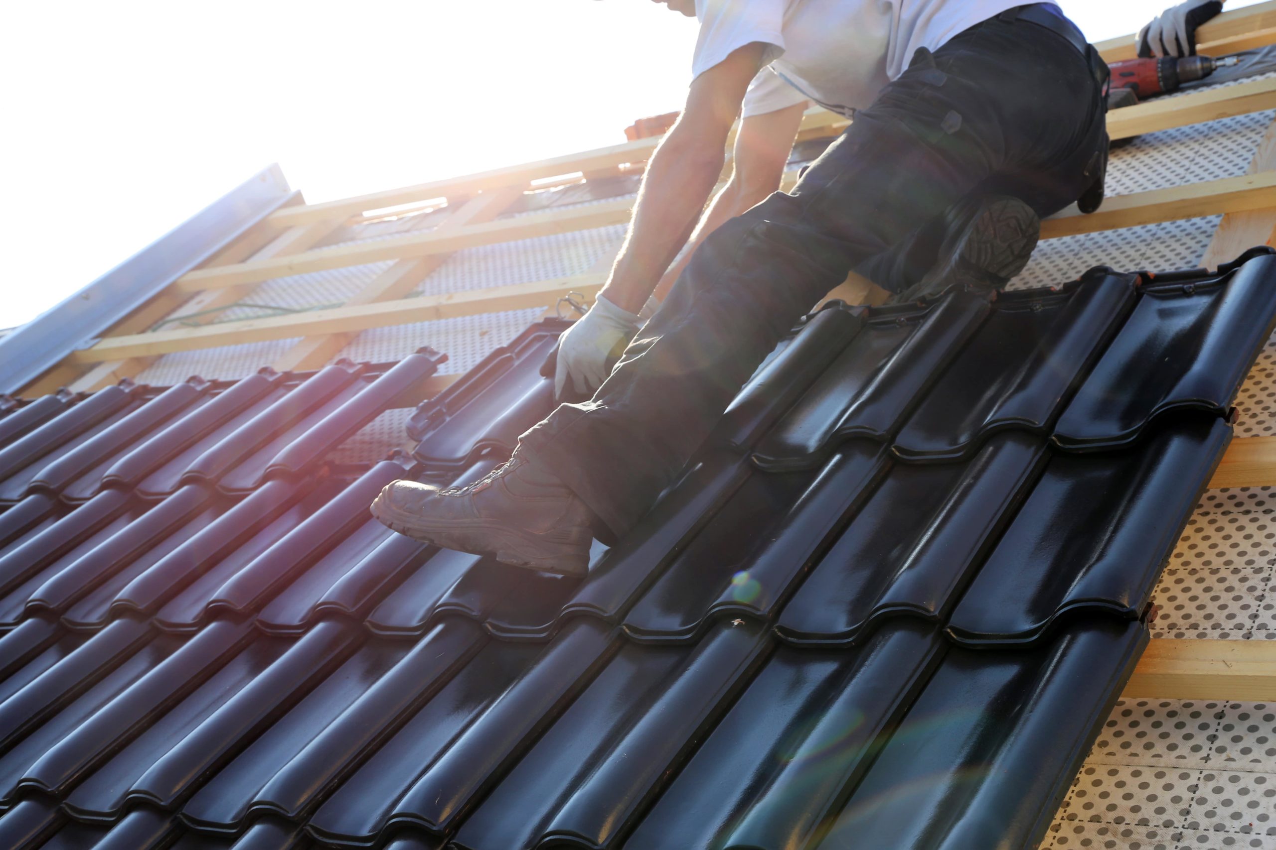 Roofer Installing Roofing Tiles - Rofing Companies - Get Your Quote