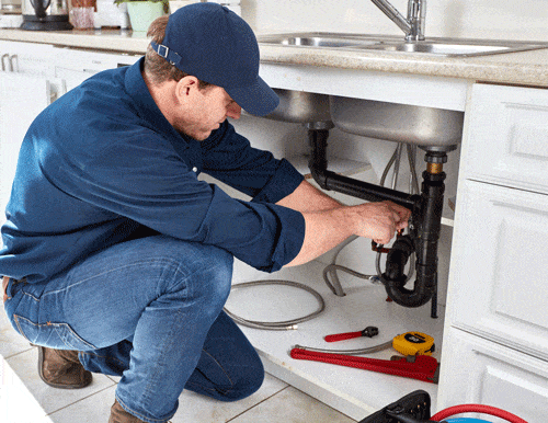 Plumber Working on a Kitchen Sink - Get Your Quote