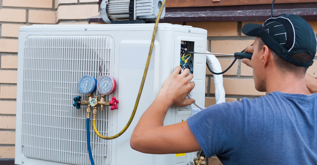 man working on Air conditioning unit