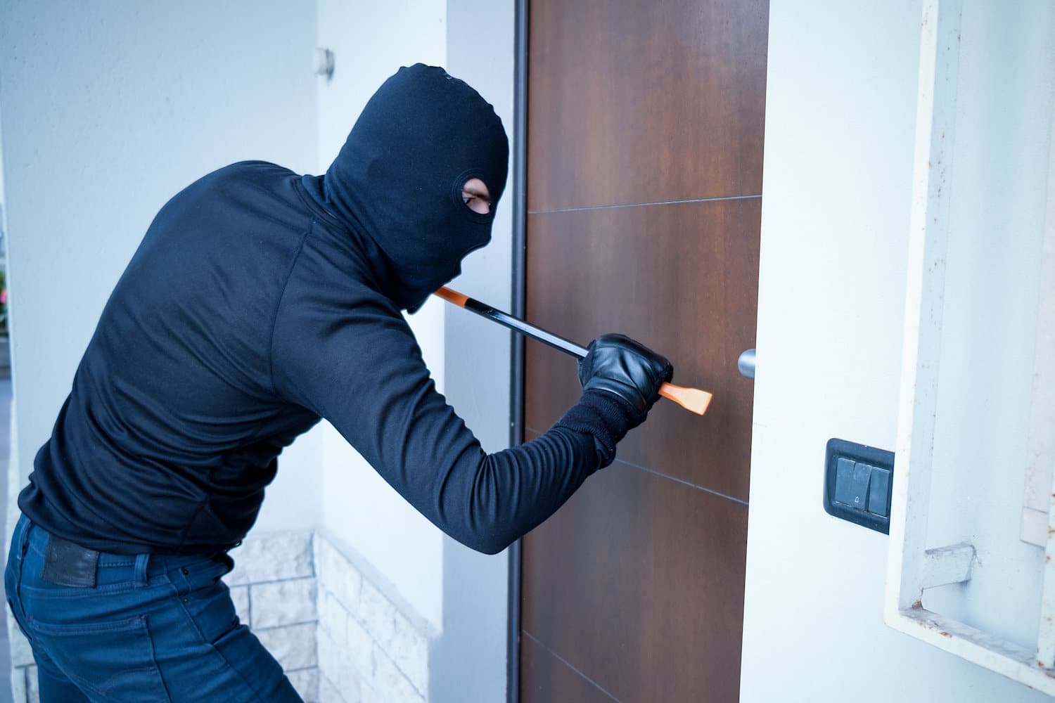 burglar prying open front door